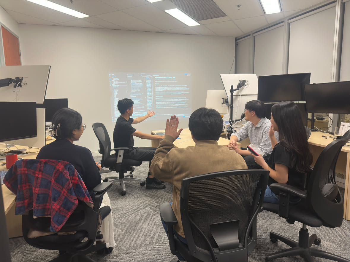 Rick Huang presenting an AI-Harness seminar to a small group at a corporate office in Toronto