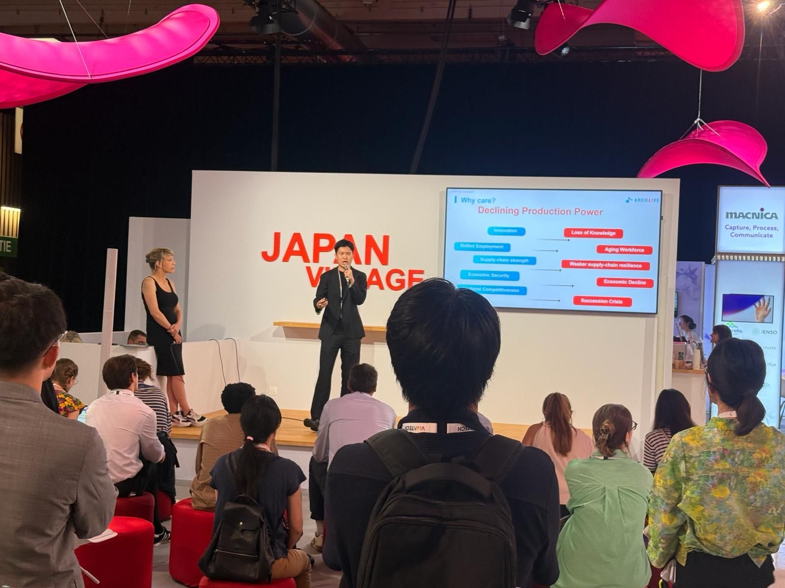 Rick Huang presenting ARCHAIVE to an audience on the Japan Village stage at VivaTech